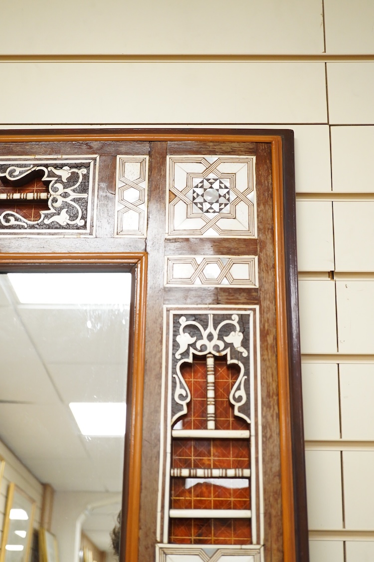 A Moroccan bone and abalone inlaid wall mirror